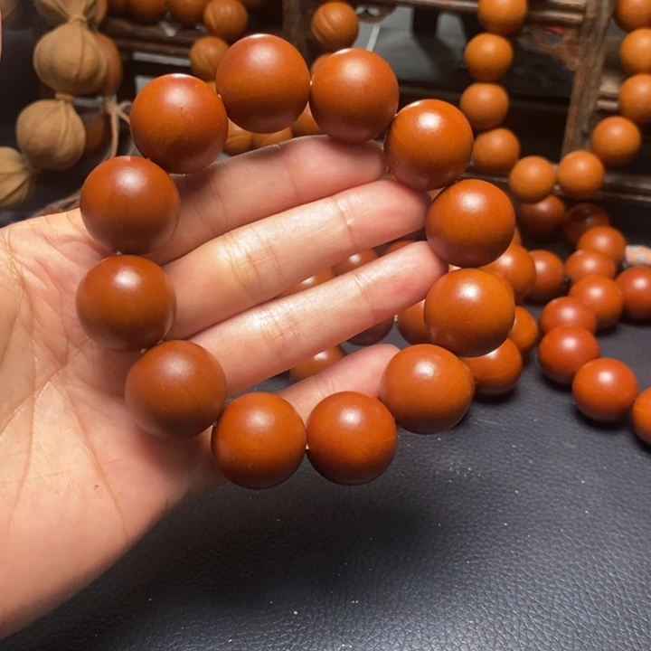 橄榄核手串2.0尺寸树王鸡血红光珠精品