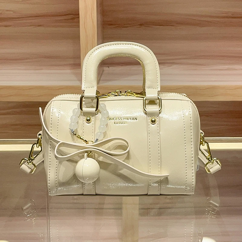 真皮轻奢手提波士顿枕头包包女2025新款高级质感小拎包百搭斜挎包