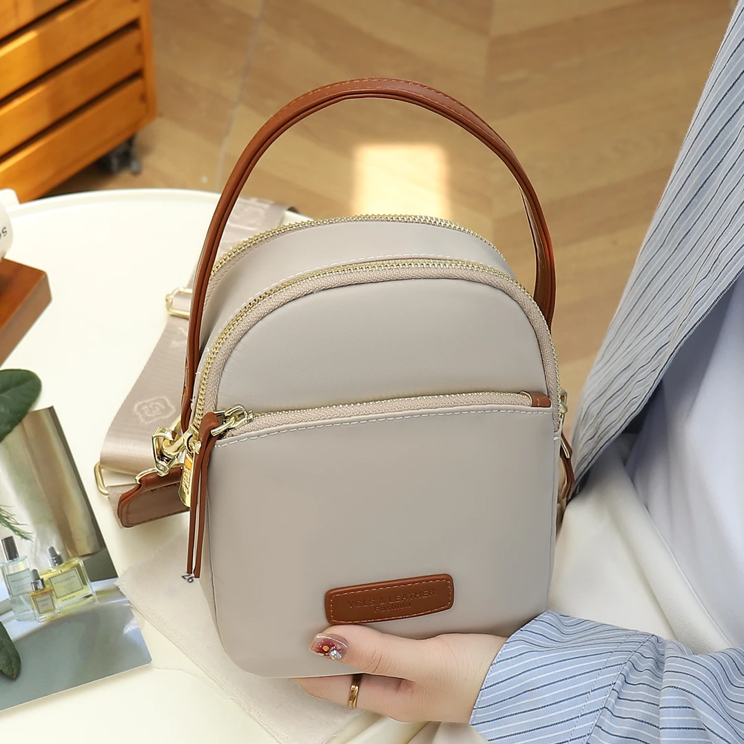 帆布包女2025新款时尚休闲多层大容量手提包外出通勤牛津布斜挎包