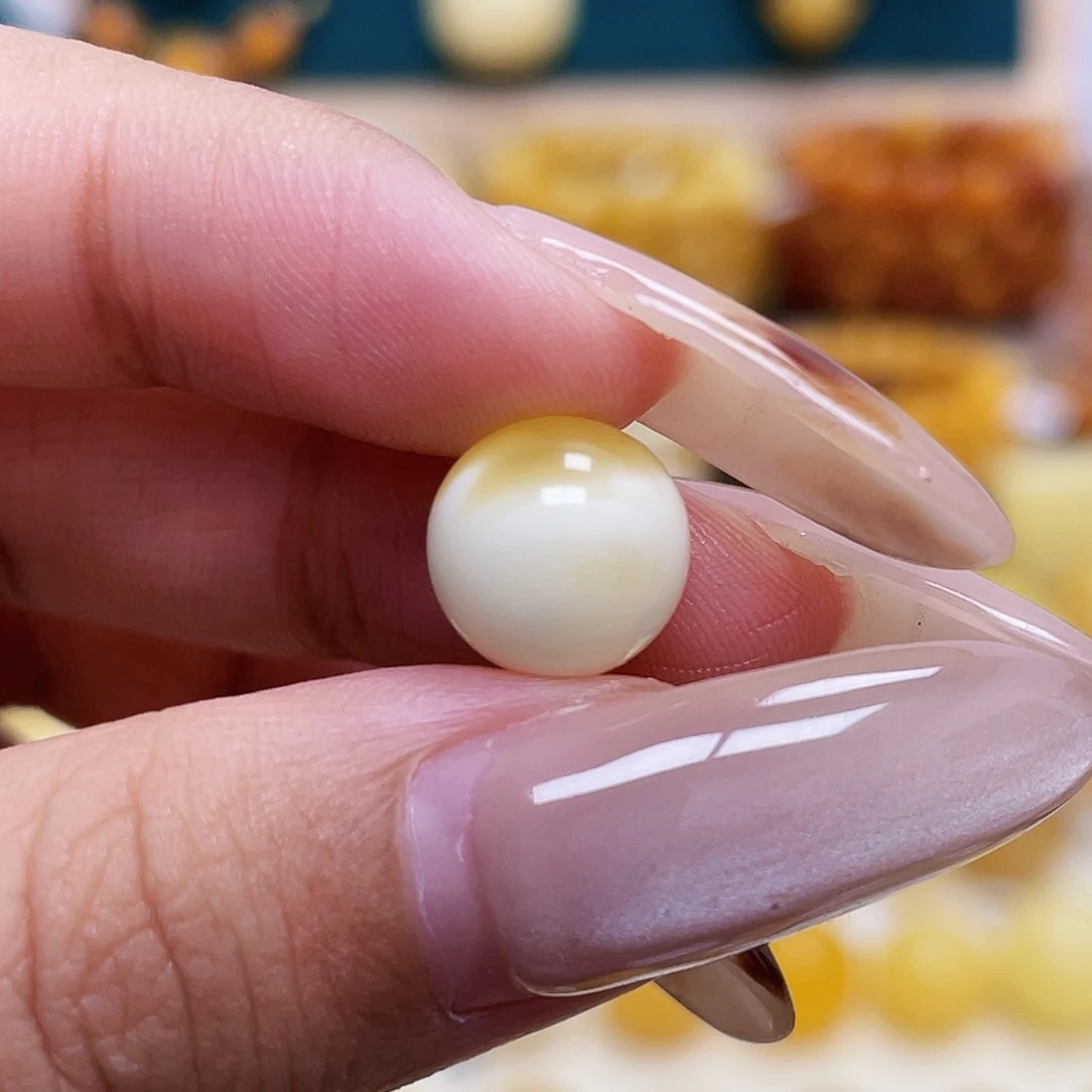 琥珀未镶嵌珠宝奇石10.0mm金瓷白溶洞