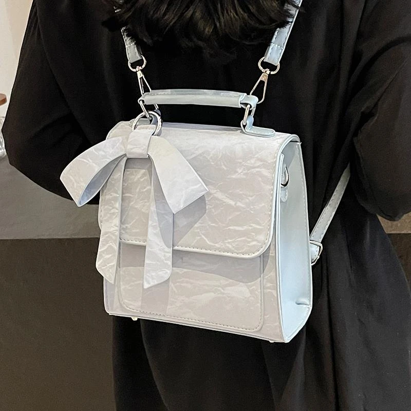 蝴蝶结双肩包女2025新款设计感小众书包学生通勤旅行后背包斜挎包