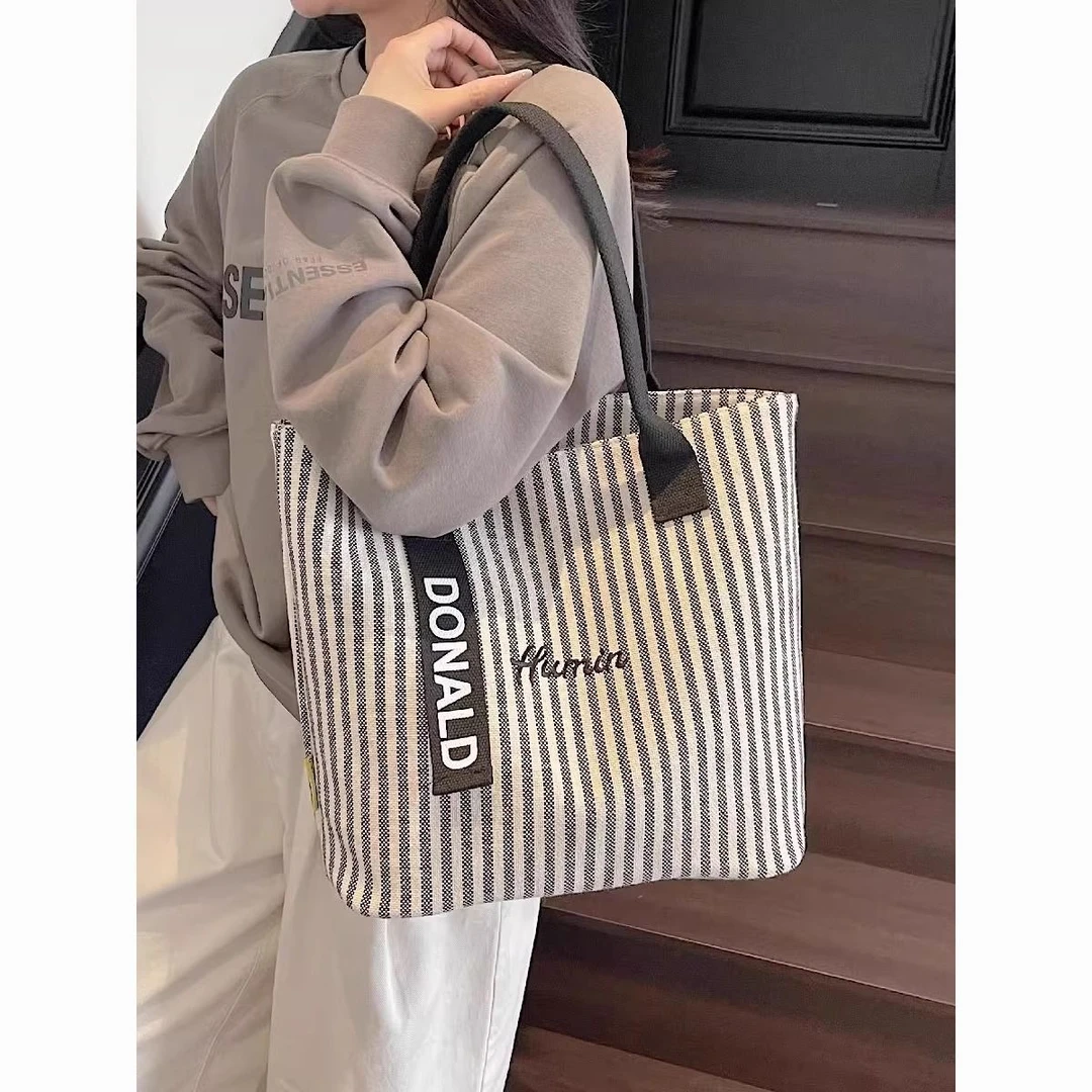 2025新款条纹大包包帆布包女时尚手提单肩水桶包休闲通勤托特小众