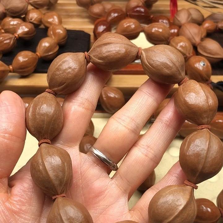 洋***洋橄榄核手串梅林铁核20 X28加三通