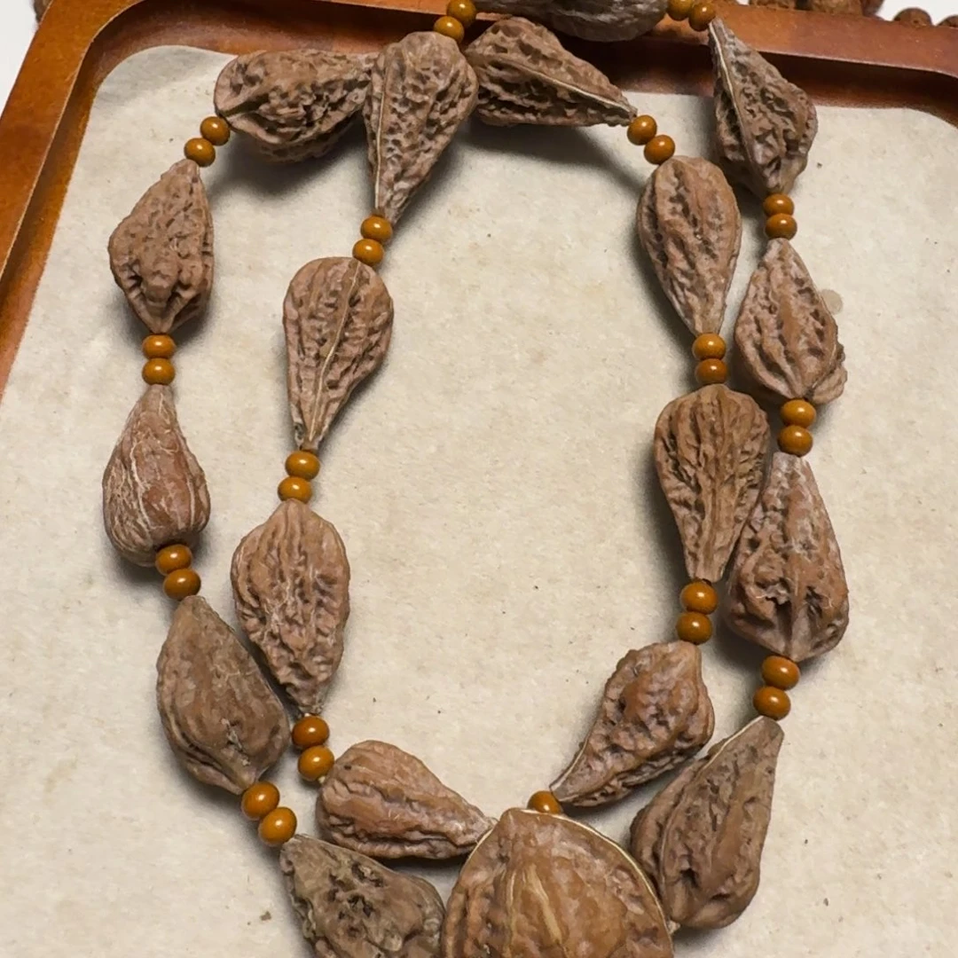 文玩核桃手串四****明异型脖挂18颗加双面鬼脸三通