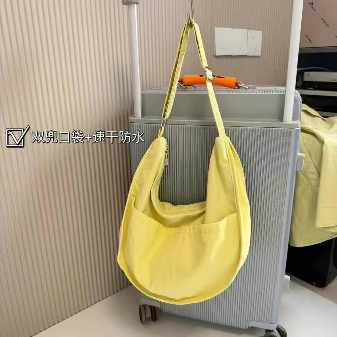 韩版休闲时尚慵懒随意百搭防水速干通勤斜挎饺子包新疆小太阳3335