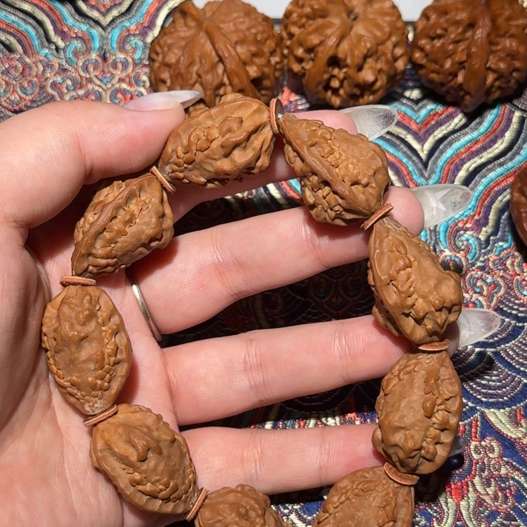 核桃把件麒麟角手持文玩核桃