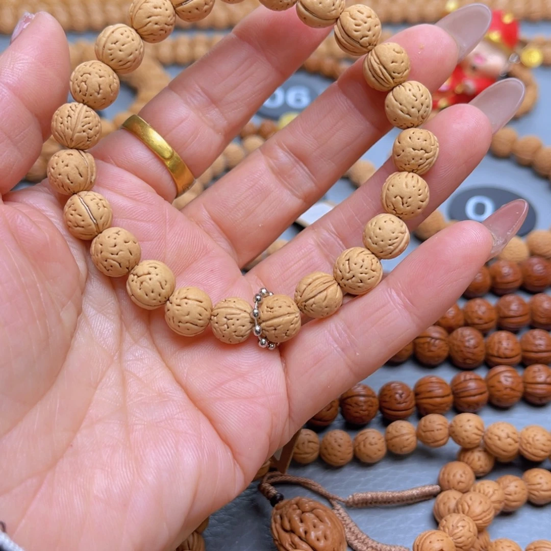 劉***_吊坠文玩核桃桃核手串