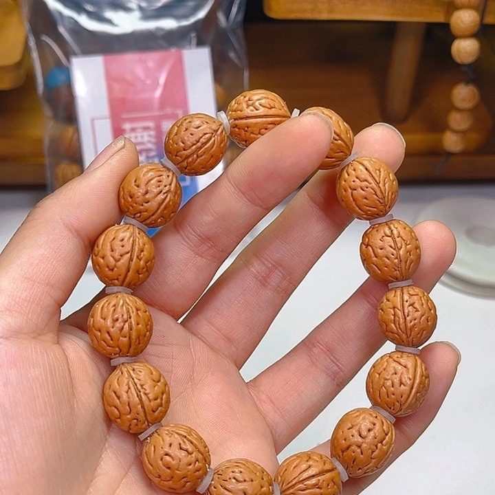 队***˘桃核吊坠桃核钱袋