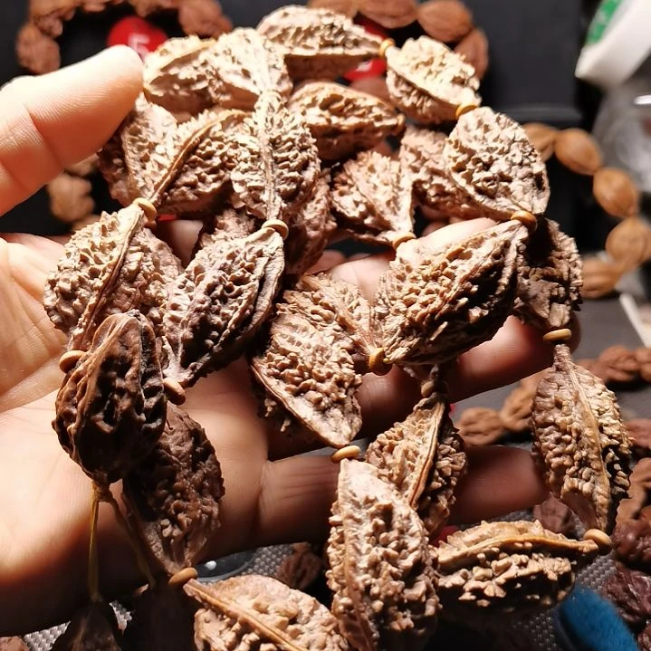 可***雅吊坠文玩核桃东北楸异形籽25