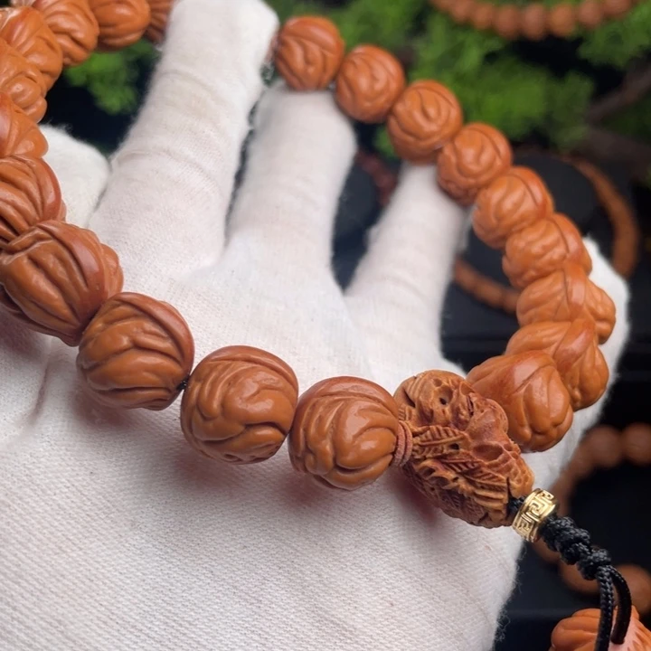 寻***渡桃核吊坠精品手持