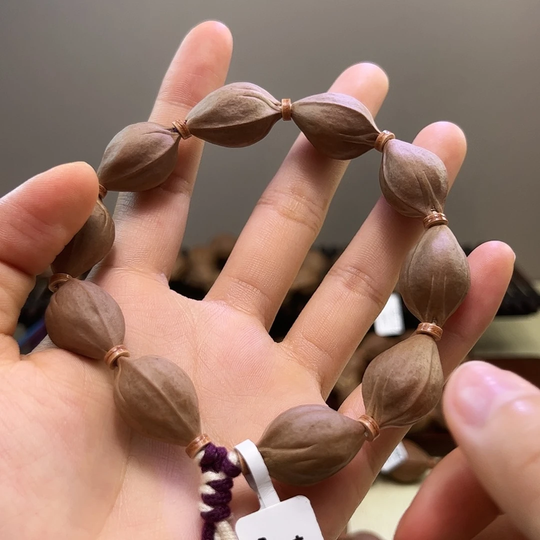 奶***倌橄榄核吊坠梅林铁核文玩手串