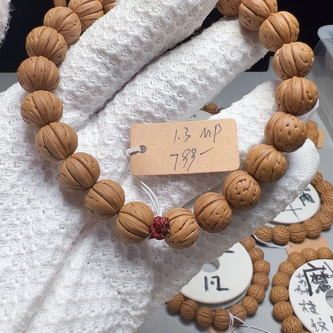 楠***木手串桃核1.3红皮一道筋磨盘