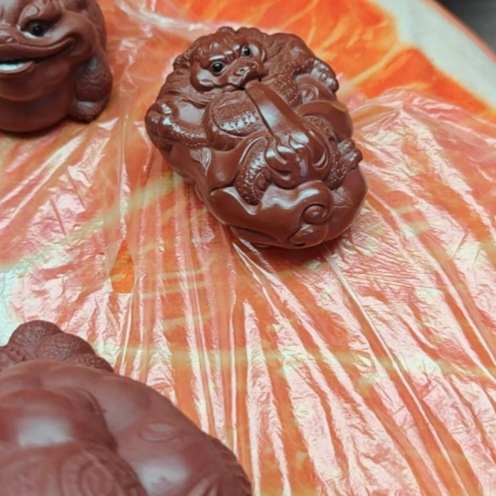 宜兴紫砂朱泥龙手把件