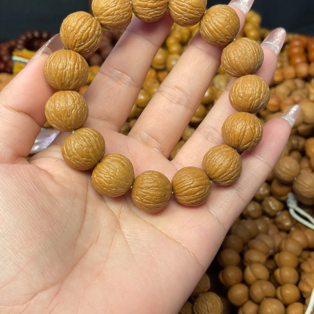 红***行手串猴头核桃全品原皮凤羽手串