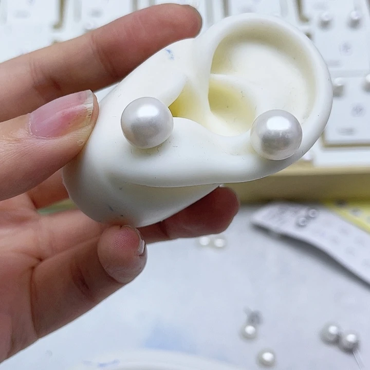 淡水珍珠耳饰银S925镶嵌两**九