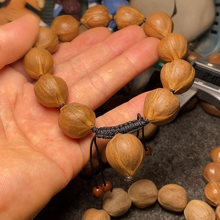 橄榄核手串1.7正圆四花32
