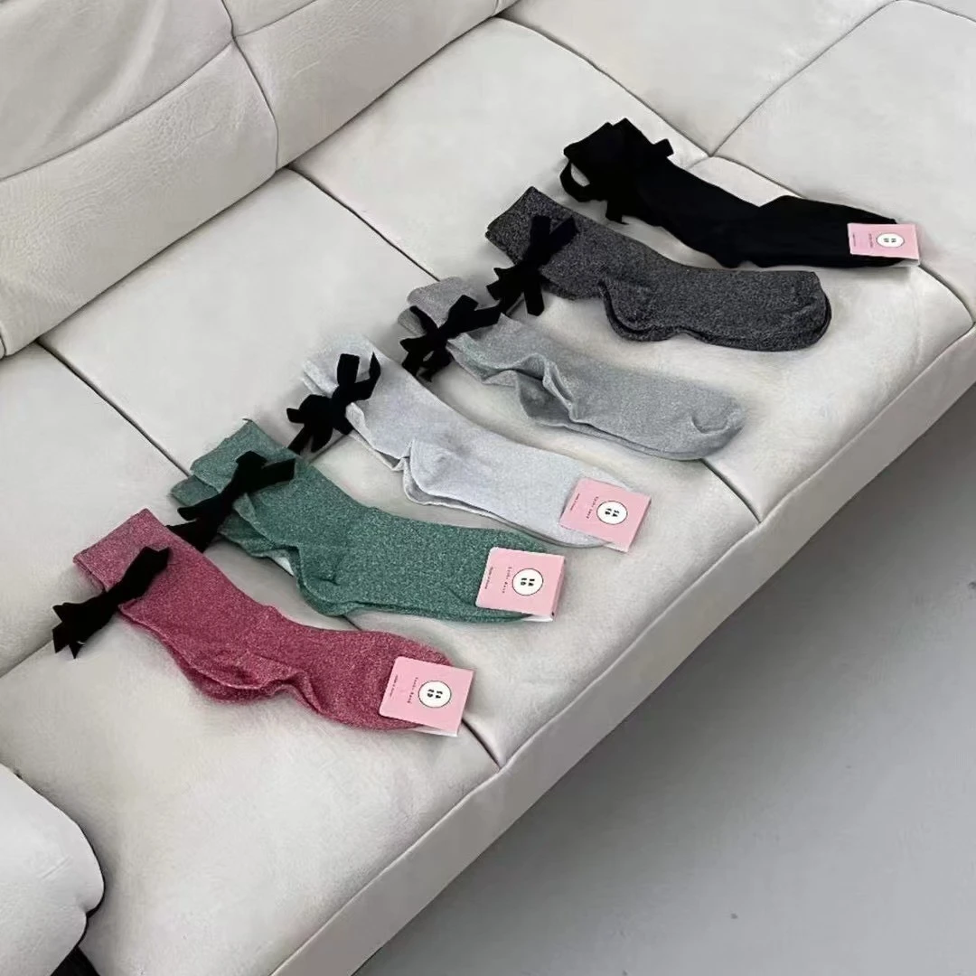 韩国东大门秋季丝绒蝴蝶结亮丝中筒袜芭蕾风少女潮款银丝堆堆袜女