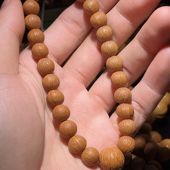 L***r猴头核桃吊坠10+精卡凤羽全品无瑕无药无修