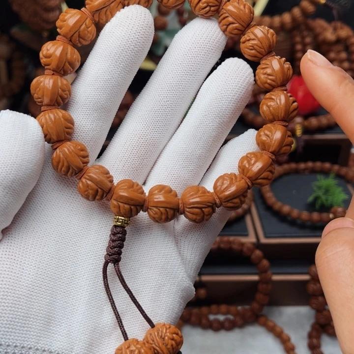 吊坠桃核14小金豆手持