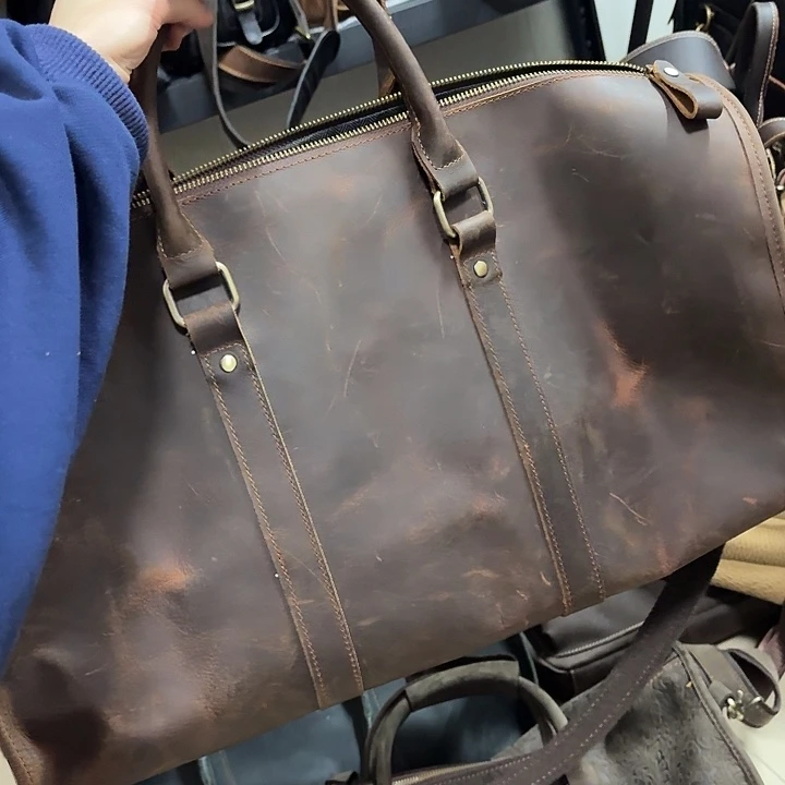 头层牛皮深棕旅行包