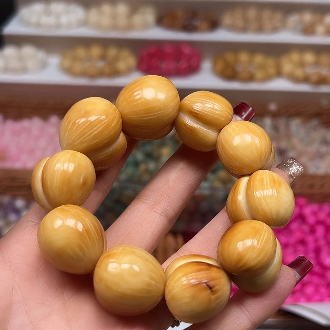 手串菩提根/象牙果瑕疵炭烤拉丝屁桃1条表面有裂