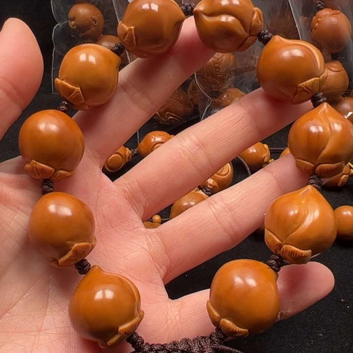黄***程橄榄核手串18寿桃