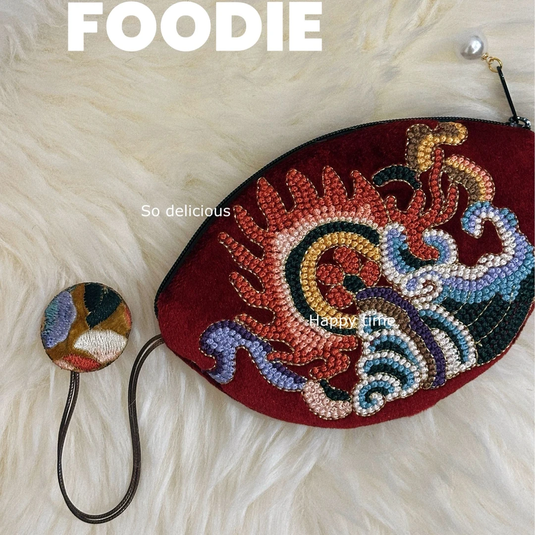 国风小众设计海螺创意打籽绣饺子包手拎流苏吊坠