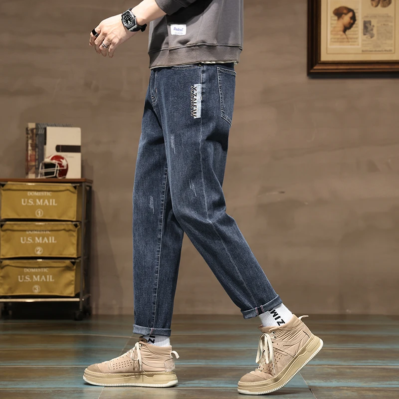 秋季新款直筒小脚修身纯色简约百搭潮流时尚舒适显身材男士牛仔裤