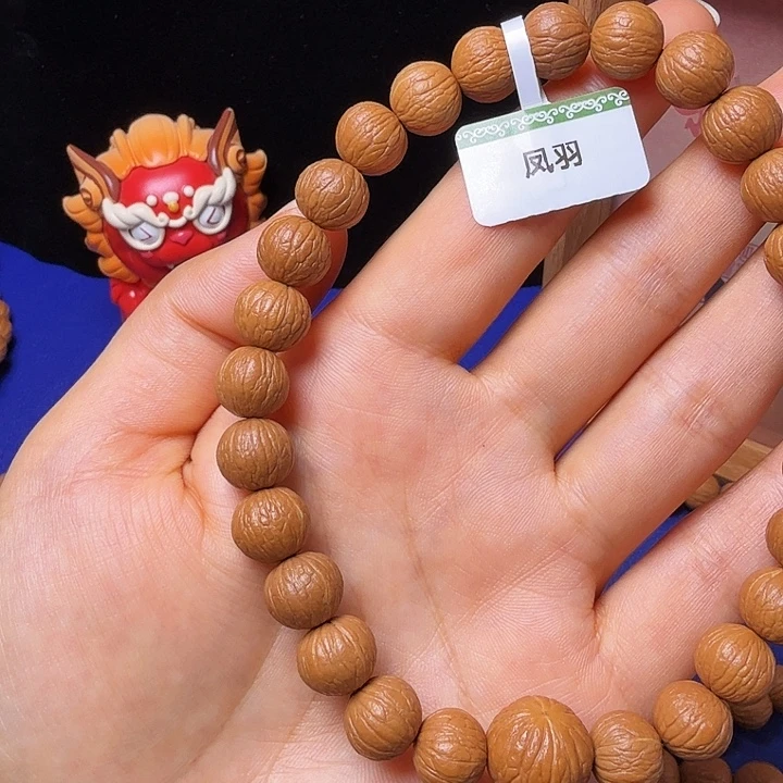 倾***笑吊坠猴头核桃凤羽