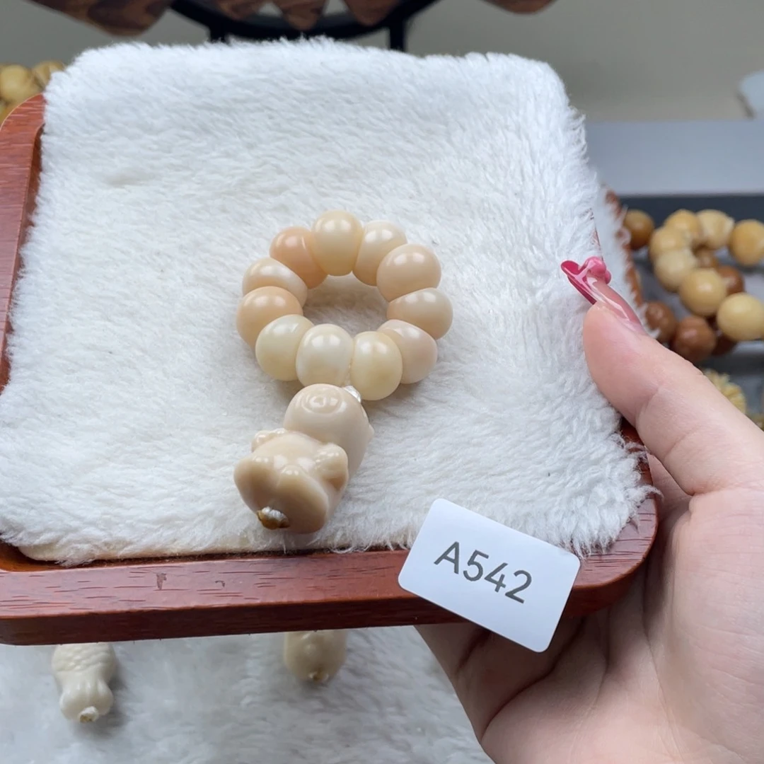 ****.菩提根/象牙果吊坠瑕A542蒜瓣手捻12mm一串