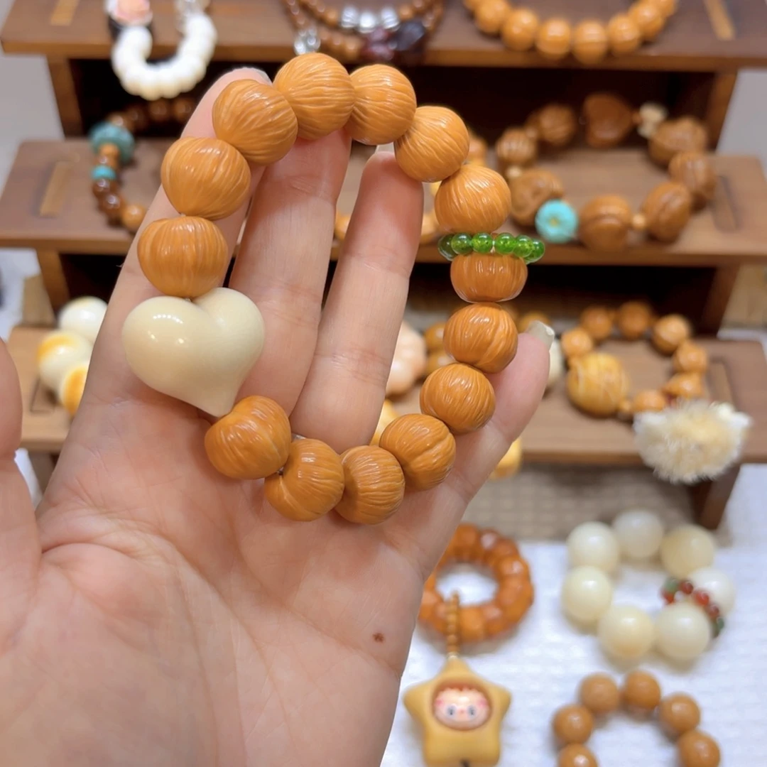 星月菩提吊坠全品猴头象牙果屁桃皮桃手串