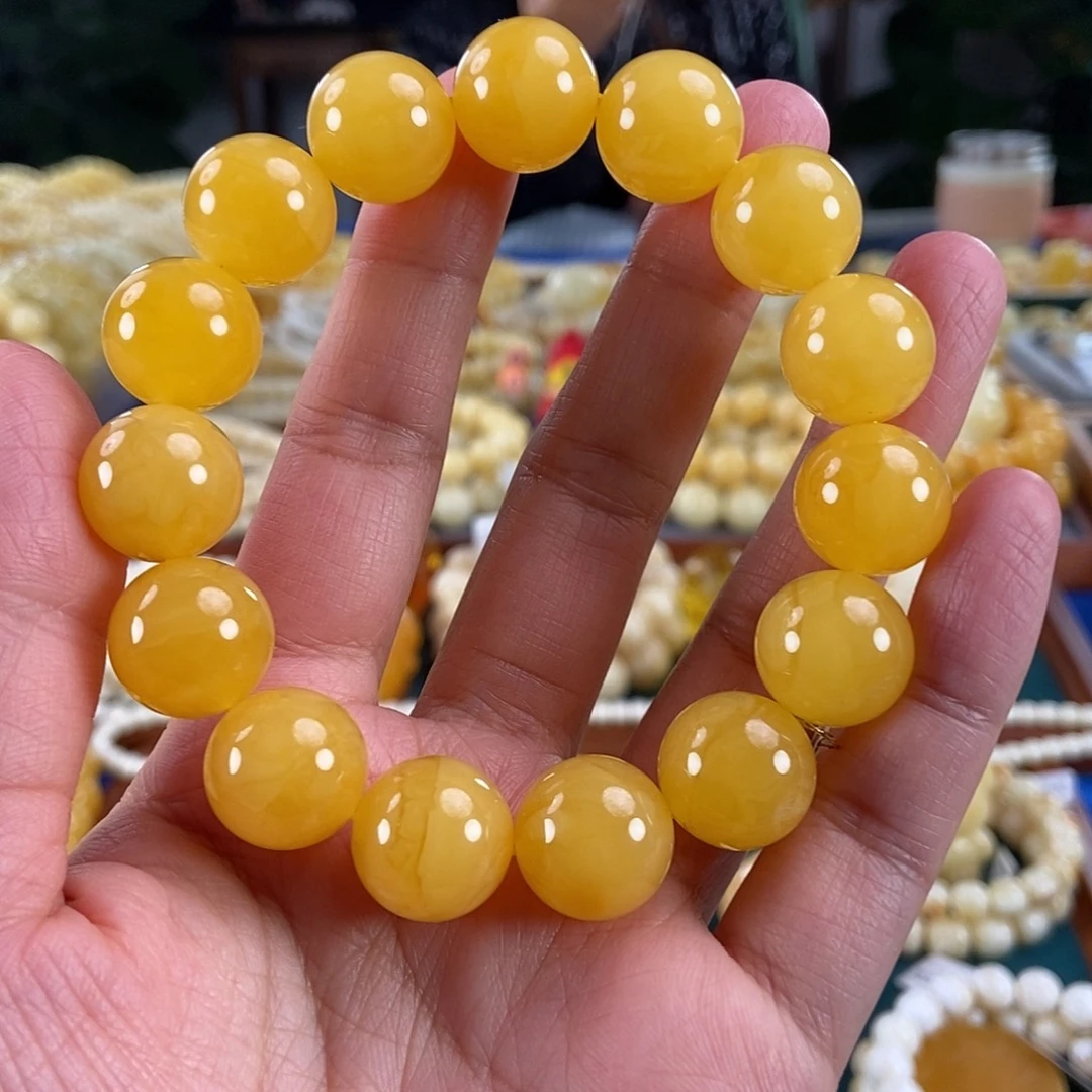 琥珀未镶嵌珠宝奇石15同料鸡油红圆珠30.26