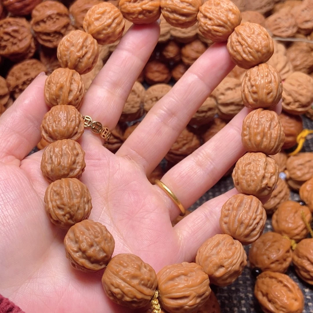 工***生桃核吊坠野生树王手持