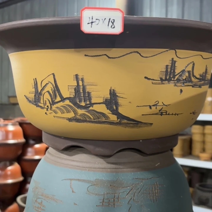 花盆紫砂110-3。   40两个35一个黄和蓝