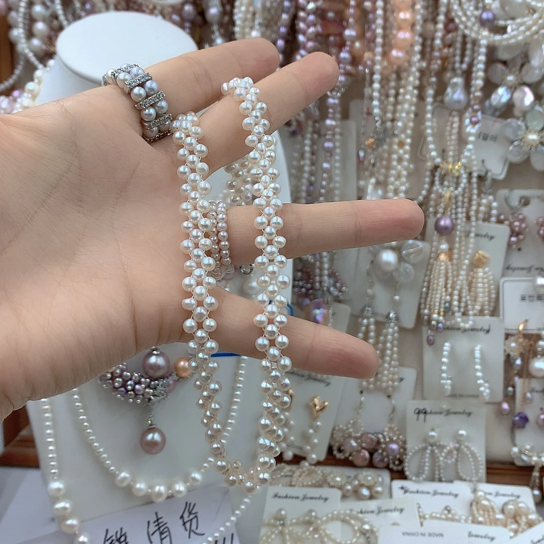 李***瘦淡水珍珠银S925镶嵌耳饰