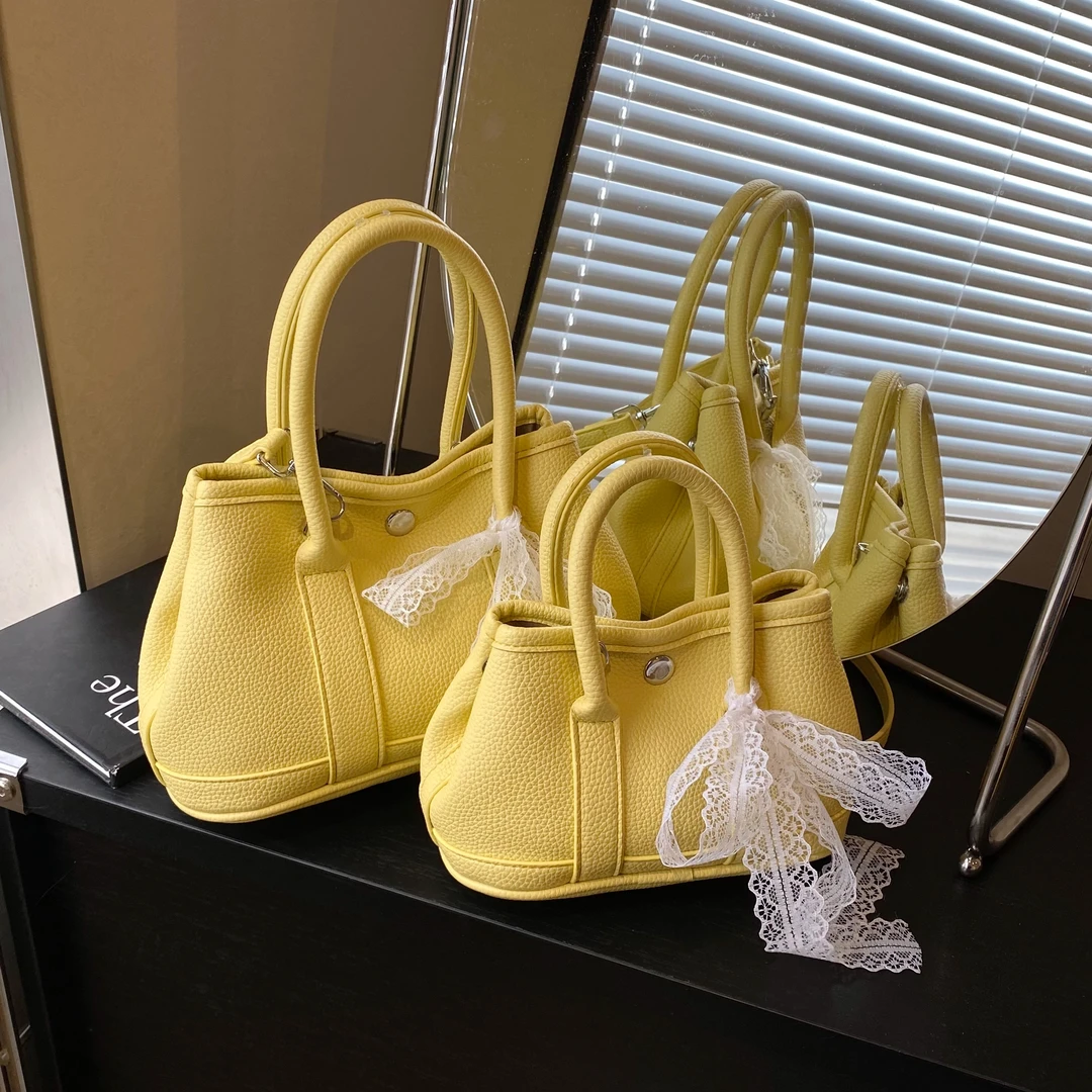 韩国手提水桶包包女2025新款潮感小众小托特包流行单肩斜挎包