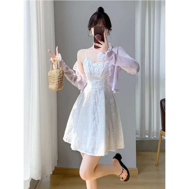 森系甜美白色刺绣吊带连衣裙女夏季2025新款高级感海边度假风短裙