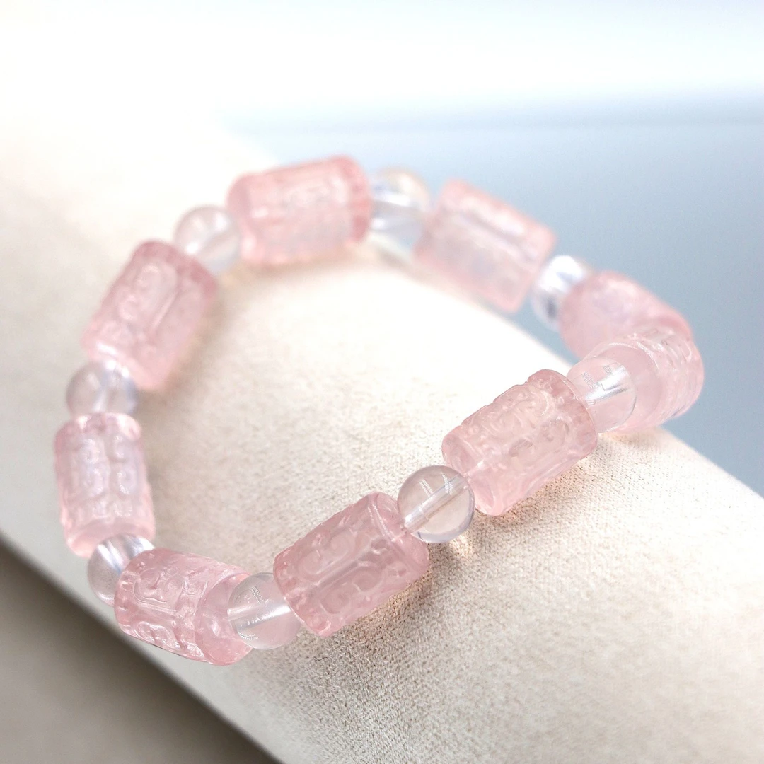 高润果冻质感回纹雕刻马达加斯加粉水晶手串G0061-尺寸约10*14mm