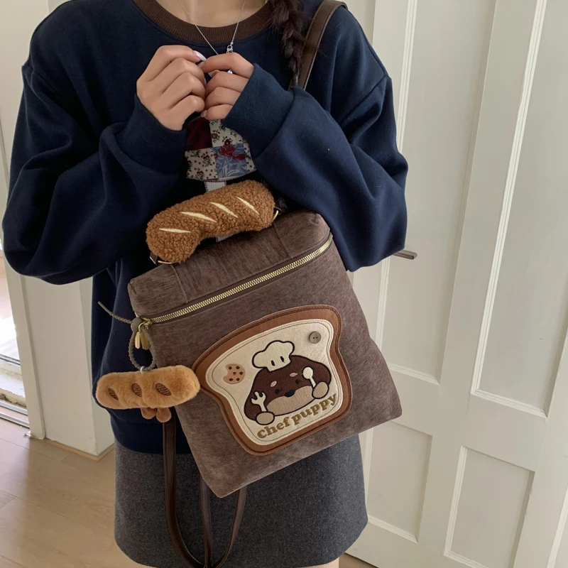 秋季时尚双肩包新小众设计通勤包简约大容量背包轻便女包小狗厨师