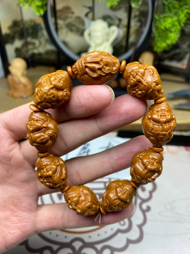 橄榄核雕工艺手串强元甲财神