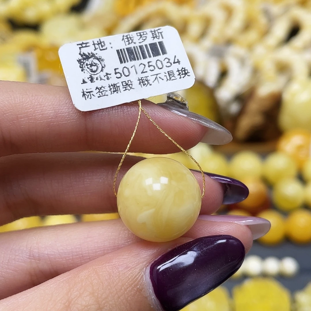 橙***爸琥珀未镶嵌裸石16.6mm浓白飘花圆珠