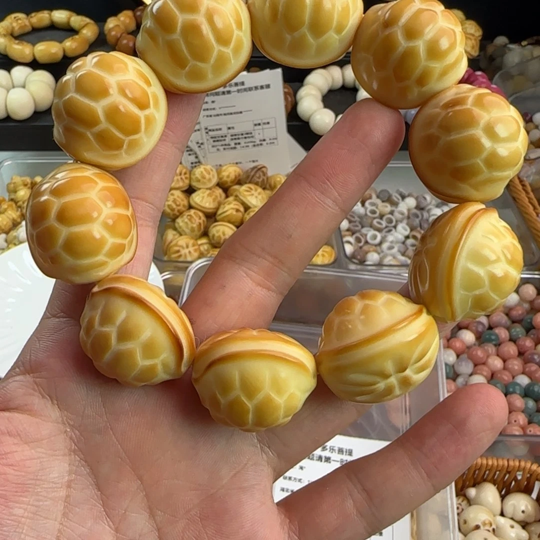 菩提根/象牙果吊坠微瑕疵炭烤大富甲手串一条