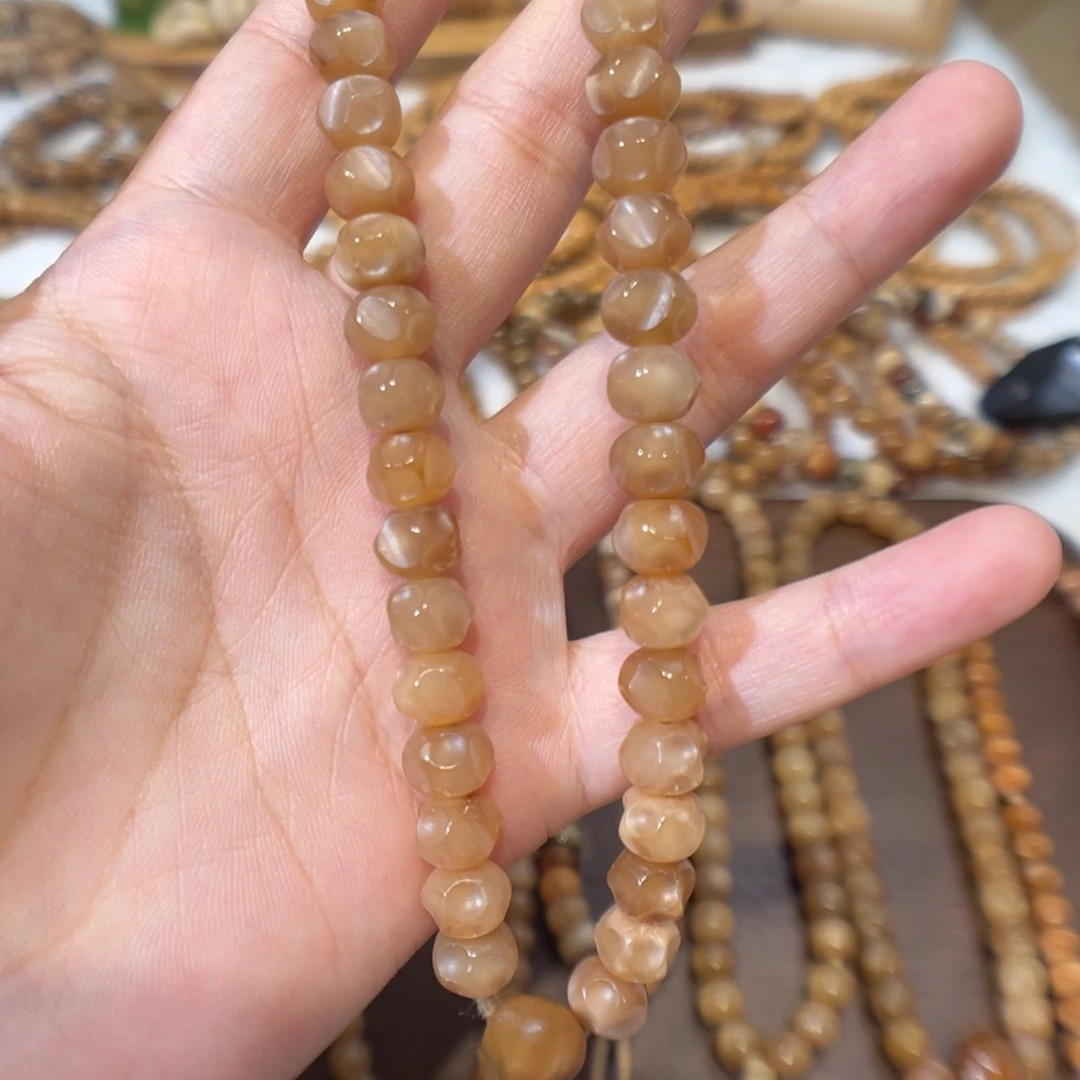 T***g龙脊菩提吊坠卡8.7无相手持玉化料46颗