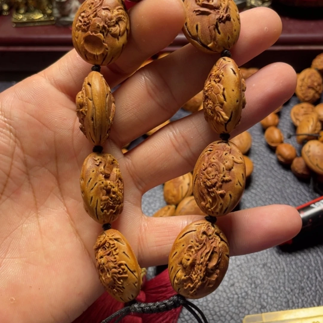 大桃核雕刻瑕疵龙生九子