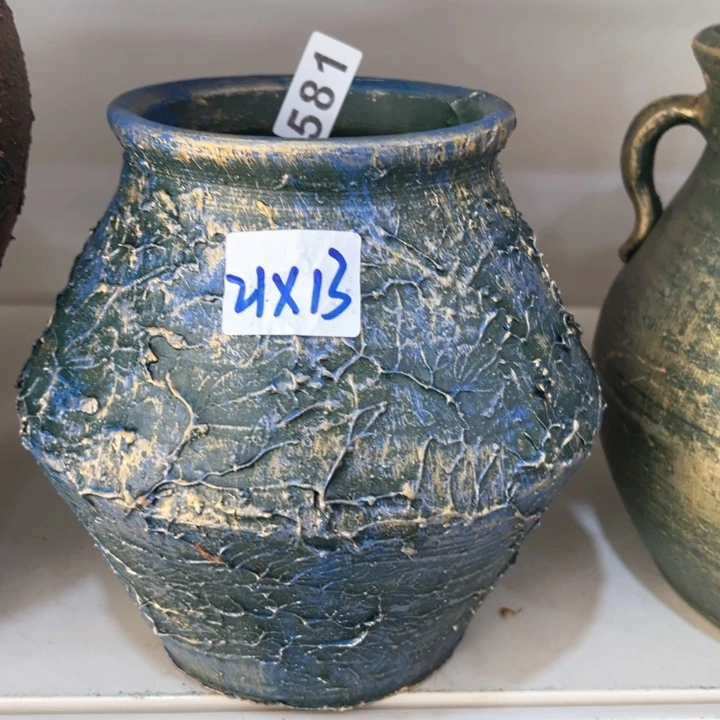 16.8-1微瑕土陶飞碟兰金