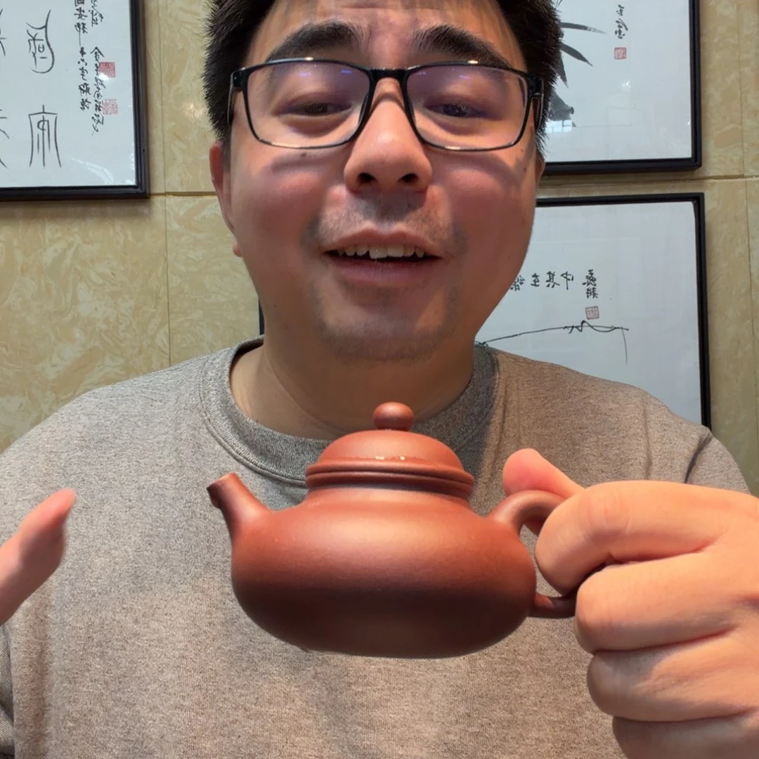 茶杯紫砂桃花泥的壶