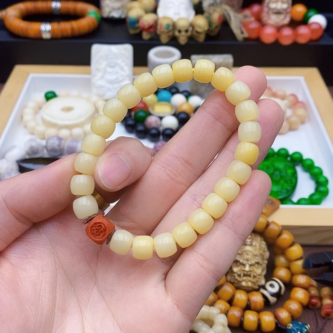 驼骨手串/手链9×8驼骨鸡油黄透