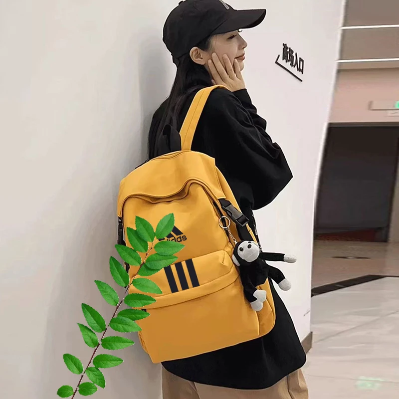 2025年情侣男女双肩包款户外休闲运动书包背包黄色33