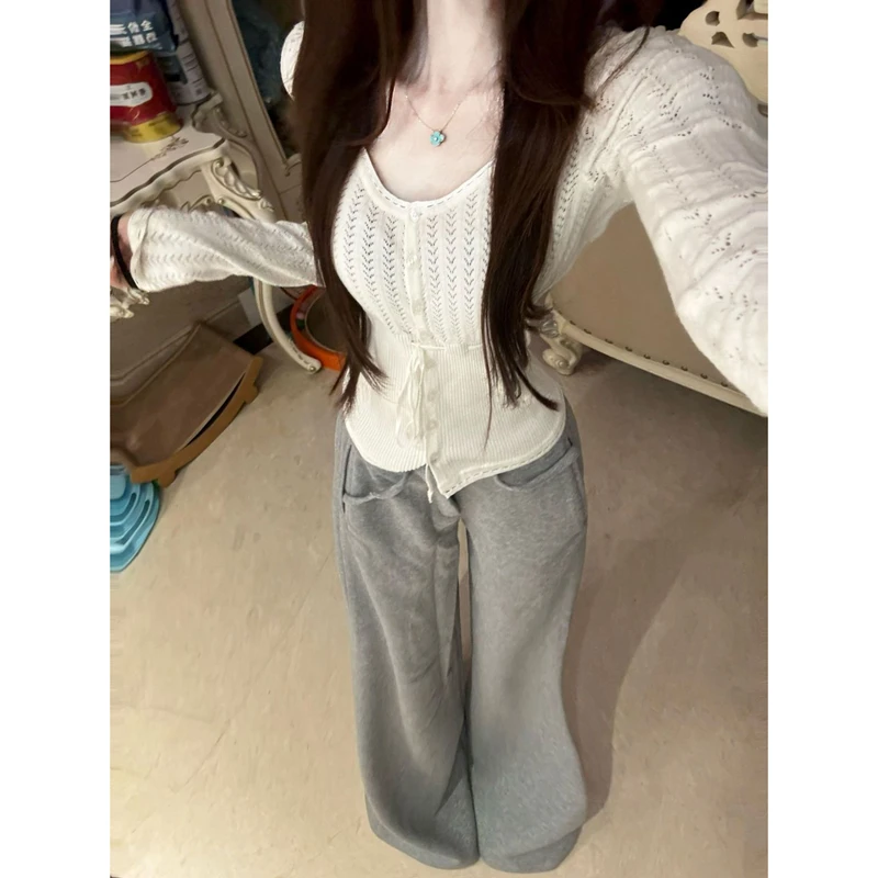 法式纯欲镂空气质长袖针织衫女秋季小众收腰显瘦别致短款套头上衣