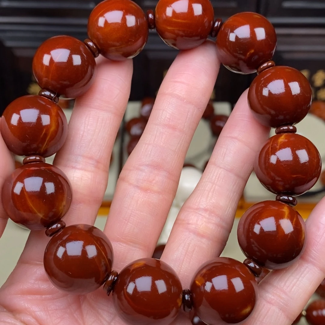 一***界橄榄核吊坠四花光珠